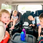 Kids and adults enjoying fun games during a car journey